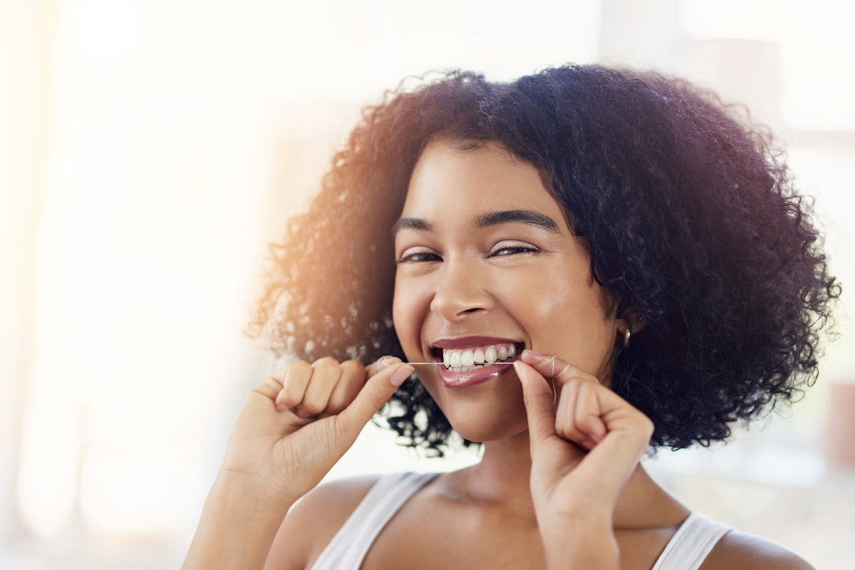 woman flossing for oral health